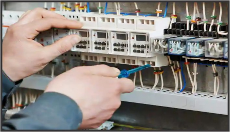 A man fixing circuit breakers